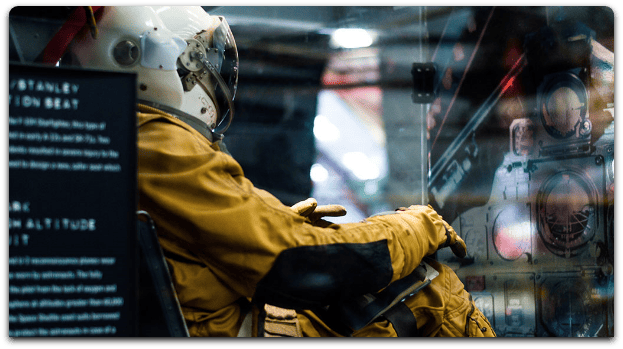 An exhibition of a astronaut sitting inside a cockpit